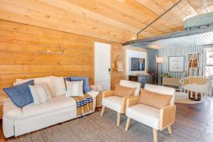 a living room with a couch and two chairs at Hike, Fish and Boat Waterfront Cabin in Ryegate! in East Ryegate
