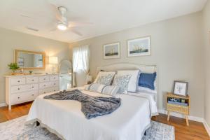 a bedroom with a bed and a dresser and a mirror at 2 Mi to Shore Modern Retreat in Fort Walton Beach in Fort Walton Beach
