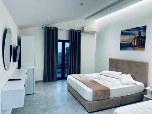 Postel nebo postele na pokoji v ubytování Molla Hotel Restorant