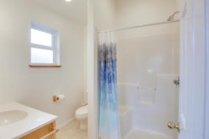 a bathroom with a shower and a sink and a toilet at 1 Block to Twin Rocks Beach Pet-Friendly Cottage in Rockaway Beach +18 photos