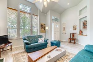 a living room with a couch and a table at Hot Tub, Fire Pit Retreat in The Woodlands! in The Woodlands