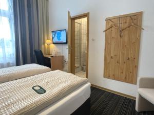 Postel nebo postele na pokoji v ubytování Hotel Antoni
