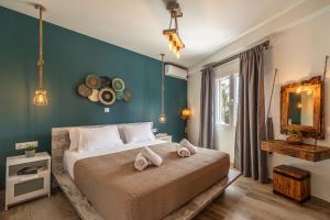 Posteľ alebo postele v izbe v ubytovaní Semiso Beach Suites