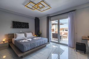 Posteľ alebo postele v izbe v ubytovaní Semiso Beach Suites