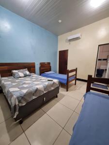 Postel nebo postele na pokoji v ubytování Hotel Avalon