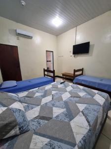 Postel nebo postele na pokoji v ubytování Hotel Avalon