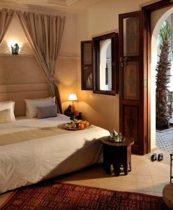 Cama ou camas em um quarto em Riad Le Jardin d'Abdou