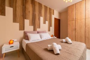 Posteľ alebo postele v izbe v ubytovaní Semiso Beach Suites