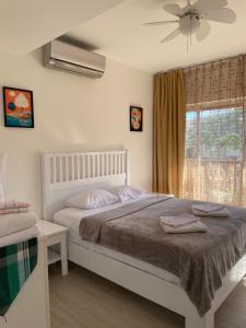 a bedroom with a large bed and a window at Luxury sea Cadaques Caribe in Bayahibe