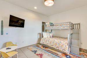a childs bedroom with a bunk bed and a desk at Families Welcome Phoenix Home with Backyard Oasis in Phoenix +23 photos