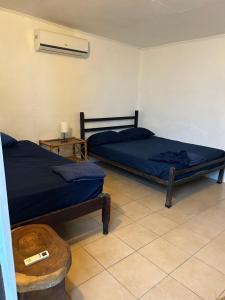 Postel nebo postele na pokoji v ubytování Pura Vida Hostel