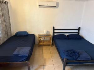 Postel nebo postele na pokoji v ubytování Pura Vida Hostel