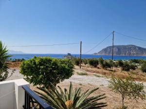 a view of the ocean from the balcony of a house at Sea View Luxury Studios in Vrachonisída Palaiókastro