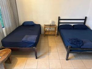 Postel nebo postele na pokoji v ubytování Pura Vida Hostel