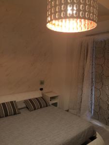 Posteľ alebo postele v izbe v ubytovaní B&B Massimo Centro