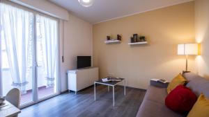 a living room with a couch and a tv at Italianway - Leonardo Da Vinci 135 in Udine