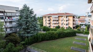 a view from the balcony of a building with a yard at Italianway - Leonardo Da Vinci 135 in Udine