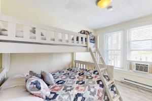 a bedroom with a bunk bed next to a window at Casa Sophia #12 in Ocean City