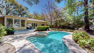 a swimming pool in the backyard of a home at 20 Port Tack in Hilton Head Island