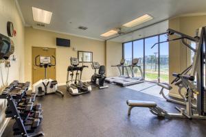 a gym with several treadmills and cardio machines at Plantation Dunes #5801 in Gulf Highlands