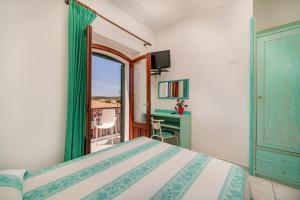 Postel nebo postele na pokoji v ubytování Hotel Marinaro