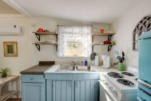 a kitchen with a sink and a stove at 6 Mi to St George Island Cozy Gulf Coast Retreat! in Eastpoint +16 photos