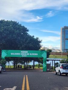 a parking lot with a sign that reads wildlifeguard squad be bitten at kitnet in Rio Verde