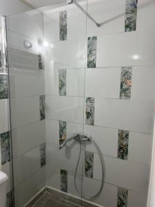 a shower with a glass door in a bathroom at Ático Sol Vecindario in Vecindario +15 photos