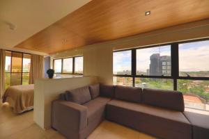 Uma área de estar em Reserva Madero Loft Natal Hotel