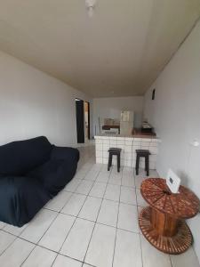a living room with a couch and a table at Apartamentos GoZu # 2 in Puerto Viejo