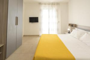 Postel nebo postele na pokoji v ubytování GS Residence