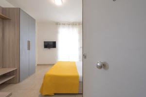 Postel nebo postele na pokoji v ubytování GS Residence