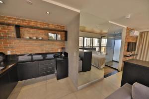 A cozinha ou cozinha compacta de Reserva Madero Loft Natal Hotel