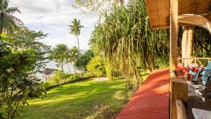 a view from the porch of a house with a yard at Dadatan Getaway in Magamomo