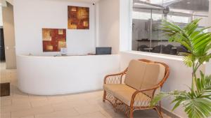 a wicker chair sitting in front of a counter at Hotel Portobelo beach in San Andrés +14 photos