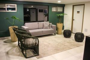 Uma área de estar em Reserva Madero Loft Natal Hotel