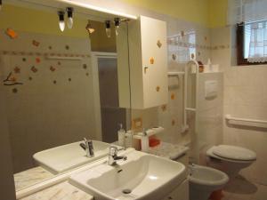 a bathroom with a sink and a toilet at B&B Al Larice in Strigno +53 photos