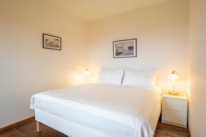 Postel nebo postele na pokoji v ubytování Rooms & Restaurace Na Jitrách