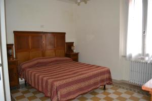 Ein Bett oder Betten in einem Zimmer der Unterkunft YourHome in Orbetello