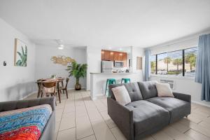 a living room with a couch and a table at Bayview Apartments By Lowkl in Fort Lauderdale