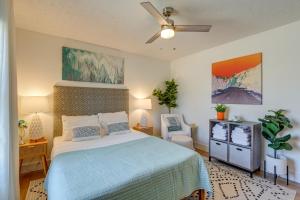 a bedroom with a bed and a ceiling fan at Family Home with Furnished Deck in Fairview! in Fairview