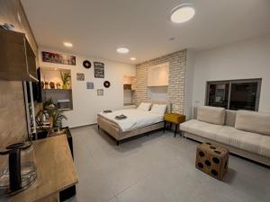 a living room with a bed and a couch at 8kmלחרמון in Majdal Shams