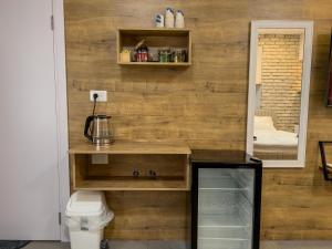 a room with a wooden wall with a counter and a toilet at 8kmלחרמון in Majdal Shams