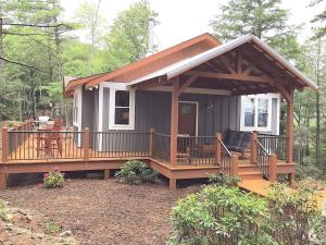 a small house with a porch and a deck at Elkhorn Rustic Blowing Rock Cabin Amazing Views in Bailey Camp