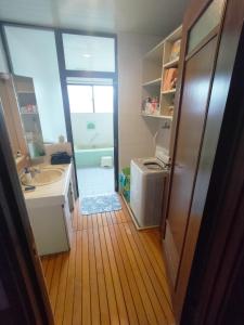 a small bathroom with a sink and a shower at Kanupata - Vacation STAY 18614 in Ishigaki Island