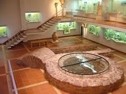 a large room with a large room with a spiral staircase at Casa à Porta do Torreão in Silves