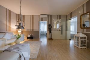 a living room with a couch and a mirror at City Central in Ljubljana