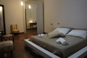Łóżko lub łóżka w pokoju w obiekcie B&B Civico 40