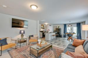 a living room with a couch and a table at Cozy Oasis Vacation Home in Vass with Gas Grill! in Vass