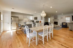 a kitchen and dining room with a table and chairs at 3 Mi to Beach Coastal Escape in Mount Pleasant in Charleston